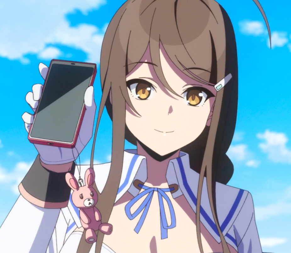 An anime girl holds up her smartphone and smiles. There is a small pink bunny decoration hanging down from the phone.